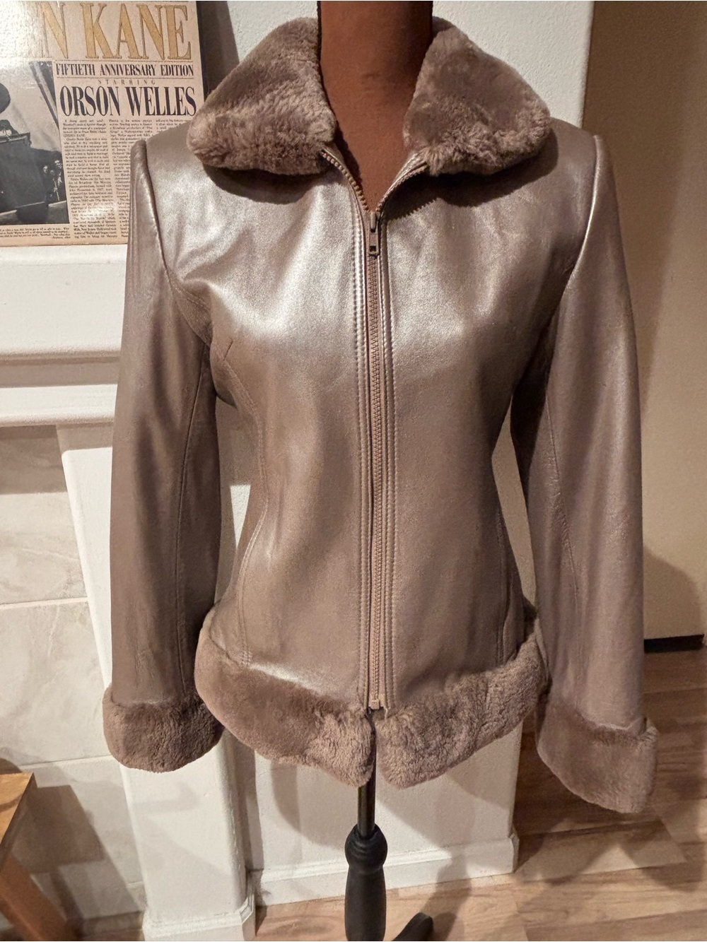 Henig women’s furs, taupe leather jacket with fur collar, cuffs, and bottom.